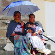 Two Ladies sitting in front of the church